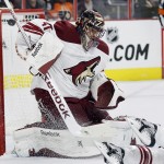 Arizona Coyotes goalie Mike Smith (41) fails to stop a shot for a goal by the Philadelphia Flyers' R. J. Umberger, not pictured, in the second period of an NHL hockey game, Tuesday, Jan. 27, 2015, in Philadelphia. (AP Photo/Tom Mihalek)