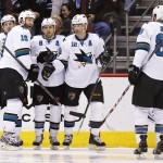 San Jose Sharks' Joe Pavelski (8) celebrates his goal against the Arizona Coyotes with teammates Joe Thornton (19), Patrick Marleau (12), Brent Burns (88) and Logan Couture (39) during the second period of an NHL hockey game Tuesday, Jan. 13, 2015, in Glendale, Ariz. (AP Photo/Ross D. Franklin)