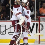 Arizona Coyotes goalie Mike Smith, left, celebrates with right wing Shane Doan after the Coyotes defeated the Anaheim Ducks 3-2 in a shootout in an NHL hockey game, Friday, Nov. 7, 2014, in Anaheim, Calif. (AP Photo/Mark J. Terrill)