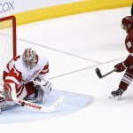 Detroit Red Wings' Petr Mrazek, left, of the Czech Republic, makes a save on a penalty shot by Arizona Coyotes' Martin Erat (10), of the Czech Republic, during the third period of an NHL hockey game Saturday, Feb. 7, 2015, in Glendale, Ariz. The Red Wings defeated the Coyotes 3-1. (AP Photo/Ross D. Franklin)