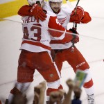 Detroit Red Wings' Darren Helm (43) celebrates his goal against the Arizona Coyotes with Tomas Tatar (21), of the Czech Republic, during the third period of an NHL hockey game Saturday, Feb. 7, 2015, in Glendale, Ariz. The Red Wings defeated the Coyotes 3-1. (AP Photo/Ross D. Franklin)
