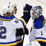 St. Louis Blues' David Backes (42), who had four goals on the night, celebrates with teammates Brian Elliott (1) and Barret Jackman after the Blues defeated the Arizona Coyotes 6-0 in an NHL hockey game Tuesday, Jan. 6, 2015, in Glendale, Ariz. (AP Photo/Ross D. Franklin)