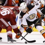 Arizona Coyotes' Mark Arcobello (36) and Anaheim Ducks' Rickard, Rakell (67), of Sweden, go after the puck during a face-off during the first period of an NHL hockey game Tuesday, March 3, 2015, in Glendale, Ariz. (AP Photo/Ross D. Franklin)