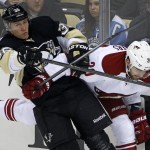 Pittsburgh Penguins' Jussi Jokinen (36) collides with Phoenix Coyotes' Chris Summers (20) in the first period of an NHL hockey game in Pittsburgh, Tuesday, March 25, 2014. (AP Photo/Gene J. Puskar)
