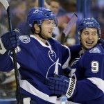 Tampa Bay Lightning right wing Nikita Kucherov, left, of Russia, celebrates with teammate center Tyler Johnson after scoring a goal against the Arizona Coyotes during the second period of an NHL hockey game Tuesday, Oct. 28, 2014, in Tampa, Fla. (AP Photo/Chris O'Meara)