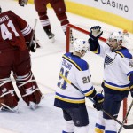 St. Louis Blues' David Backes (42) celebrates his third goal during the second period against Arizona Coyotes' Mike Smith (41) with teammate Patrik Berglund (21), of Sweden, during an NHL hockey game Tuesday, Jan. 6, 2015, in Glendale, Ariz. (AP Photo/Ross D. Franklin)