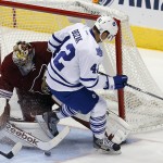 Arizona Coyotes goalie Mike Smith (41) makes the save on Toronto Maple Leafs center Tyler Bozak (42) in the second period during an NHL hockey game, Tuesday, Nov. 4, 2014, in Glendale, Ariz. (AP Photo/Rick Scuteri)