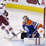 Arizona Coyotes' Tobias Rieder (8) scores a goal against Edmonton Oilers goalie Viktor Fasth (35) during the second period of an NHL hockey game in Edmonton, Alberta, on Monday, Dec. 1, 2014. (AP Photo/The Canadian Press, Jason Franson)