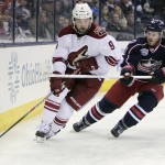 Arizona Coyotes' Sam Gagner, left, looks for an open pass as Columbus Blue Jackets' James Wisniewski defends during the third period of an NHL hockey game Tuesday, Feb. 3, 2015, in Columbus, Ohio. The Coyotes won 4-1. (AP Photo/Jay LaPrete)
