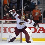 Arizona Coyotes goalie Mike Smith celebrates the Coyotes' 3-2 win over the Anaheim Ducks, following the shootout in an NHL hockey game, Friday, Nov. 7, 2014, in Anaheim, Calif. (AP Photo/Mark J. Terrill)