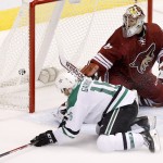 Dallas Stars' Ryan Garbutt (16) scores a short-handed goal on Arizona Coyotes' Mike Smith during the third period of an NHL hockey game Tuesday, Nov. 11, 2014, in Glendale, Ariz. The Stars defeated the Coyotes 4-3. (AP Photo/Ross D. Franklin)