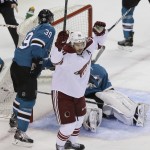 Arizona Coyotes center Antoine Vermette reacts after scoring a power play goal during the first period of an NHL hockey game against the San Jose Sharks Saturday, Nov. 22, 2014, in San Jose, Calif. In the background are San Jose Sharks center Logan Couture (39) and goalie Antti Niemi. (AP Photo/Eric Risberg)