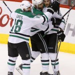 Dallas Stars' Tyler Seguin (91) celebrates his first goal against the Arizona Coyotes with teammates Patrick Eaves (18) and Trevor Daley (6) during the second period of an NHL hockey game Tuesday, Nov. 11, 2014, in Glendale, Ariz. (AP Photo/Ross D. Franklin)