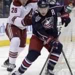 Columbus Blue Jackets' Mark Letestu, right, controls the puck as Arizona Coyotes' Michael Stone defends during the second period of an NHL hockey game Tuesday, Feb. 3, 2015, in Columbus, Ohio. (AP Photo/Jay LaPrete)
