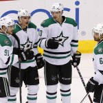 Dallas Stars' Tyler Seguin (91) celebrates his second goal against the Arizona Coyotes with teammates Antoine Roussel (21), Jason Spezza (90), and Trevor Daley (6) during the second period of an NHL hockey game Tuesday, Nov. 11, 2014, in Glendale, Ariz. (AP Photo/Ross D. Franklin)