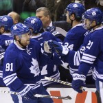 Toronto Maple Leafs' Phil Kessel (81) celebrates his goal against the Arizona Coyotes with teammates during the first period of an NHL hockey game Thursday, Jan. 29, 2015, in Toronto. (AP Photo/The Canadian Press, Frank Gunn)
