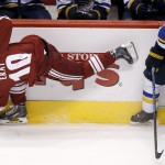 St. Louis Blues' Barret Jackman (5) checks Arizona Coyotes' Martin Erat (10), of the Czech Republic, into the boards during the second period of an NHL hockey game Saturday, Oct. 18, 2014, in Glendale, Ariz. (AP Photo/Ross D. Franklin)