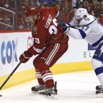 Arizona Coyotes' Brandon Gormley (33) tries to keep the puck away from Tampa Bay Lightning's Alex Killorn (17) during the first period of an NHL hockey game Saturday, Feb. 21, 2015, in Glendale, Ariz. (AP Photo/Ross D. Franklin)