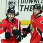 Ottawa Senators' Mika Zibanejad (93) celebrates his goal against the Arizona Coyotes with teammate Jared Cowan (2) during the second period of an NHL hockey game in Ottawa, Ontario, Saturday, Jan. 31, 2015. (AP Photo/The Canadian Press, Fred Chartrand)