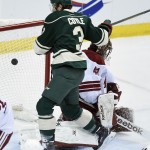Minnesota Wild center Charlie Coyle (3) scores a goal against Arizona Coyotes goalie Mike Smith (41) during the first period of an NHL hockey game Saturday, Jan. 17, 2015, in St. Paul, Minn. (AP Photo/Hannah Foslien)
