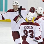 Arizona Coyotes' Sam Gagner (9), Connor Murphy (5) and Brandon Gormley (33) celebrate a goal against the Edmonton Oilers during the third period of an NHL hockey game in Edmonton, Alberta, Tuesday, Dec. 23, 2014. The Coyotes won 5-1. (AP Photo/The Canadian Press, Jason Franson)
