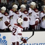 Arizona Coyotes' Justin Hodgeman (52) celebrates his goal with teammates during the first period of an NHL preseason hockey game against the San Jose Sharks on Friday, Sept. 26, 2014, in San Jose, Calif. (AP Photo/Marcio Jose Sanchez)