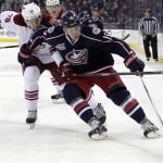 Columbus Blue Jackets' Ryan Johansen, right, keeps the puck away from Arizona Coyotes' Michael Stone during the second period of an NHL hockey game Tuesday, Feb. 3, 2015, in Columbus, Ohio. (AP Photo/Jay LaPrete)
