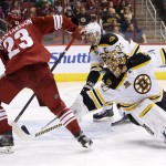 
Phoenix Coyotes' Oliver Ekman-Larsson (23), of Sweden, scores a goal against Boston Bruins' Tuukka Rask (40), of Finland, as Bruins' Zdeno Chara (33), of the Czech Republic, arrives late to defend during the second period of an NHL hockey game on Saturday, March 22, 2014, in Glendale, Ariz. (AP Photo/Ross D. Franklin)
