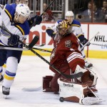 Arizona Coyotes' Mike Smith, right, makes a save on a shot by St. Louis Blues' Jaden Schwartz (17) during the first period of an NHL hockey game Tuesday, Jan. 6, 2015, in Glendale, Ariz. (AP Photo/Ross D. Franklin)