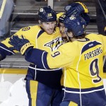 Nashville Predators left wing James Neal (18) celebrates with Mike Ribeiro (63) and Filip Forsberg (9), of Sweden, after scoring a goal against the Arizona Coyotes in the third period of an NHL hockey game Tuesday, Oct. 21, 2014, in Nashville, Tenn. (AP Photo/Mark Humphrey)
