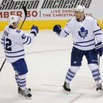 Toronto Maple Leafs defenseman Cody Franson, right, celebrates with Tyler Bozak after scoring against the Arizona Coyotes in the third period during an NHL hockey game, Tuesday, Nov. 4, 2014, in Glendale, Ariz. The Coyotes won 3-2. (AP Photo/Rick Scuteri)