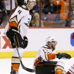 Anaheim Ducks' Ryan Kesler, right, smiles as he gets up off the ice after scoring a short-handed goal against the Arizona Coyotes as teammate Cam Fowler (4) skates in to celebrate during the first period of an NHL hockey game Tuesday, March 3, 2015, in Glendale, Ariz. (AP Photo/Ross D. Franklin)