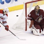 Arizona Coyotes' Mike Smith (41) makes a save on a shot by Carolina Hurricanes' Jeff Skinner (53) during the second period of an NHL hockey game Thursday, Feb. 5, 2015, in Glendale, Ariz. (AP Photo/Ross D. Franklin)
