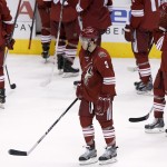 Phoenix Coyotes' Keith Yandle (3) and Kyle Chipchura (24) skate dejectedly off the ice after an NHL hockey game shootout loss to the Winnipeg Jets, Tuesday, April 1, 2014, in Glendale, Ariz. The Jets defeated the Coyotes 2-1 in a shootout. (AP Photo/Ross D. Franklin)