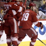  Phoenix Coyotes' Oliver Ekman-Larsson, left, of Sweden, celebrates his goal against the Boston Bruins with teammates Mikkel Boedker, of Denmark, and Shane Doan (19) during the second period of an NHL hockey game on Saturday, March 22, 2014, in Glendale, Ariz. (AP Photo/Ross D. Franklin)