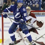 Tampa Bay Lightning right wing Nikita Kucherov (86), of Russia, tips the puck past Arizona Coyotes goalie Mike Smith for a goal during the first period of an NHL hockey game Tuesday, Oct. 28, 2014, in Tampa, Fla. (AP Photo/Chris O'Meara)