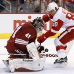 Arizona Coyotes' Mike Smith (41) makes a save on a shot by Detroit Red Wings' Stephen Weiss (90) during the first period of an NHL hockey game Saturday, Feb. 7, 2015, in Glendale, Ariz. (AP Photo/Ross D. Franklin)