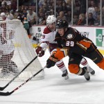 Anaheim Ducks left wing Matt Beleskey, right, and Arizona Coyotes right wing Shane Doan race for the puck as goalie Mike Smith watches during the second period of an NHL hockey game, Friday, Nov. 7, 2014, in Anaheim, Calif. (AP Photo/Mark J. Terrill)