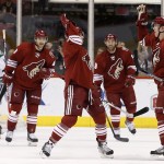 Arizona Coyotes' Connor Murphy (5) gets a high-five from teammate Keith Yandle as they celebrate Murphy's goal against Dallas Stars' Kari Lehtonen, left, of Finland, as Coyotes' Sam Gagner (9) and Tobias Rieder (8), of Germany, look on and Stars' Shawn Horcoff, second from left, looks back at the celebrating Coyotes players during the first period of an NHL hockey game Tuesday, Nov. 11, 2014, in Glendale, Ariz. (AP Photo/Ross D. Franklin)