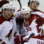 Phoenix Coyotes' Antoine Vermette (50) celebrates with teammates after his goal in the first period of an NHL hockey game against the Pittsburgh Penguins in Pittsburgh, Tuesday, March 25, 2014. (AP Photo/Gene J. Puskar)
