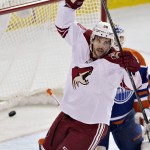Arizona Coyotes Antoine Vermette (50) celebrates a goal by a teammate against Edmonton Oilers goalie Ben Scrivens (30) during first period NHL hockey action in Edmonton, Alberta, on Sunday, Nov. 16, 2014. (AP Photo/The Canadian Press, Jason Franson)