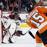 Philadelphia Flyers' Michael Del Zotto (15), right, shoots and scores past Arizona Coyotes goalie Mike Smith (41) in the second period of an NHL hockey game, Tuesday, Jan. 27, 2015, in Philadelphia. (AP Photo/Tom Mihalek)