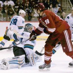 Arizona Coyotes' Shane Doan (19) scores a goal against San Jose Sharks' Antti Niemi, left, of Finland, as Sharks' Joe Pavelski, right, and Justin Braun, second from right, defend and Logan Couture (39) looks back during the second period of an NHL hockey game Tuesday, Jan. 13, 2015, in Glendale, Ariz. (AP Photo/Ross D. Franklin)