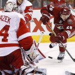 Detroit Red Wings' Petr Mrazek (34), of the Czech Republic, prepares to make a save on a shot by Arizona Coyotes' Lauri Korpikoski (28), of Finland, during the second period of an NHL hockey game Saturday, Feb. 7, 2015, in Glendale, Ariz. (AP Photo/Ross D. Franklin)