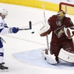 Arizona Coyotes' Mike Smith, right, makes a save on a shot by Tampa Bay Lightning's Ryan Callahan (24) during the second period of an NHL hockey game Saturday, Feb. 21, 2015, in Glendale, Ariz. (AP Photo/Ross D. Franklin)