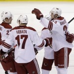  Phoenix Coyotes defenseman Oliver Ekman-Larsson, with arm raised, of Sweden, celebrates his goal with teammates during the second period of an NHL hockey game against the Florida Panthers, Tuesday, March 11, 2014, in Sunrise, Fla. (AP Photo/Wilfredo Lee)