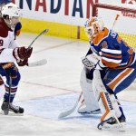 Arizona Coyotes Shane Doan (19) is stopped by Edmonton Oilers goalie Ben Scrivens (30) during second period NHL hockey action in Edmonton, on Sunday, Nov. 16, 2014. (AP Photo/The Canadian Press, Jason Franson)