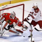 Chicago Blackhawks goalie Antti Raanta (31) makes a save on a shot by Arizona Coyotes center Kyle Chipchura during the second period of an NHL hockey game Tuesday, Jan. 20, 2015, in Chicago. (AP Photo/Charles Rex Arbogast)
