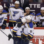 St. Louis Blues' Jaden Schwartz (17) celebrates his hat trick against the Arizona Coyotes with teammates Vladimir Tarasenko (91), of Russia; Maxim Lapierre (40); Ryan Reaves (75); T.J. Oshie (74) and Steve Ott (9) during the third period of an NHL hockey game Saturday, Oct. 18, 2014, in Glendale, Ariz. The Blues defeated the Coyotes 6-1. (AP Photo/Ross D. Franklin)