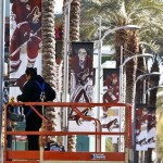 A worker finishes adjusting banners depicting Phoenix Coyotes players outside Jobing.com Arena as the NHL hockey team practices inside in preparation for the start of the lockout-shortened season, Tuesday, Jan. 15, 2013, in Glendale, Ariz. (AP Photo/Ross D. Franklin)